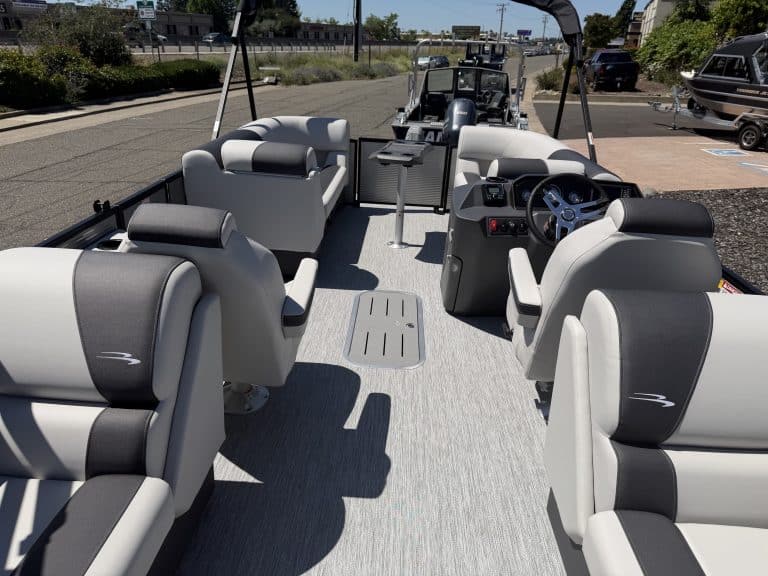Pontoon boat interior with comfortable seating and modern controls.