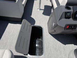 Boat deck storage compartment with open lid, part of a modern marine vessel.