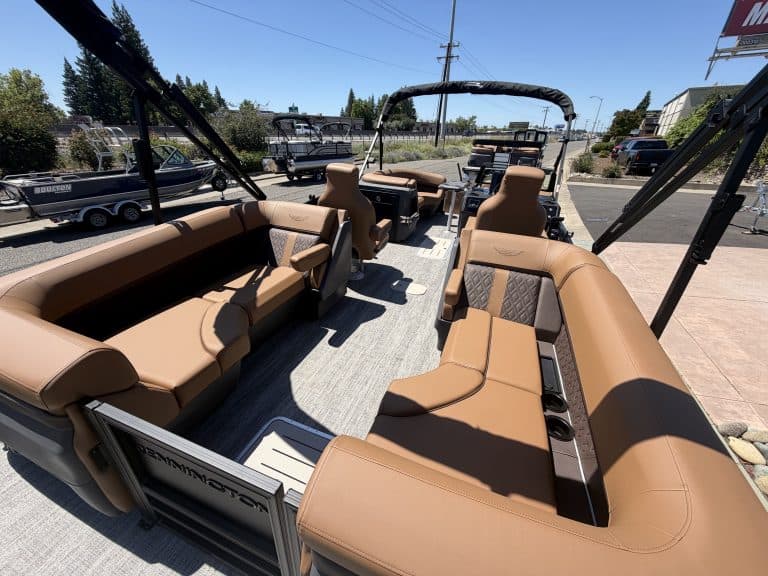 Luxury boat interior with tan seating and canopy for outdoor boating.
