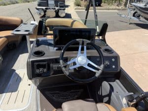 Boat dashboard with steering wheel and electronic controls for Bennington M 23 250HP.