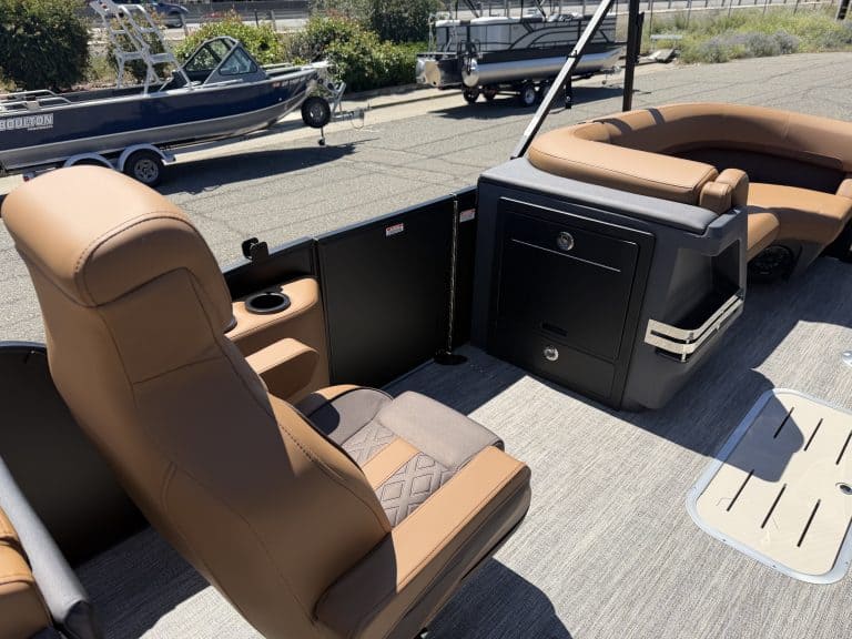Luxury boat interior with tan seating and modern console, ideal for boating adventures.