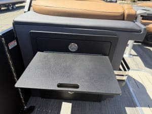 Foldable tray table on Bennington M 23 boat seat for convenience.