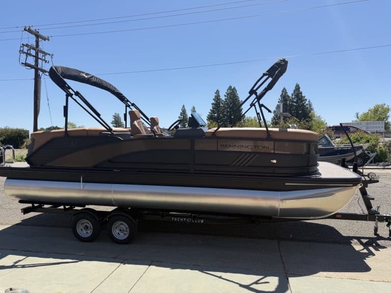 Bennington M 23 pontoon boat with 250HP outboard motor on trailer.