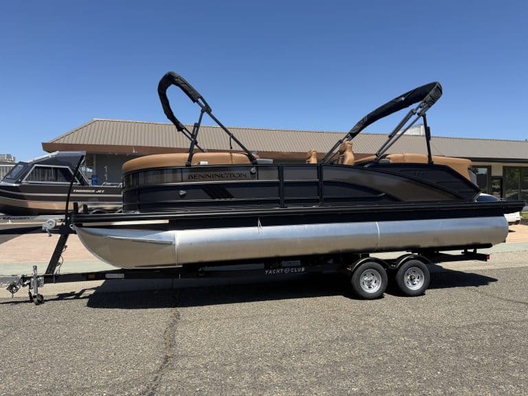 Bennington M 23 pontoon boat with 250HP outboard engine on trailer.