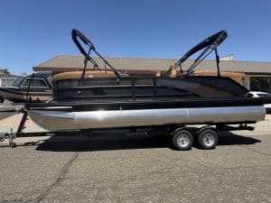 Bennington M 23 pontoon boat with 250HP outboard engine on trailer.
