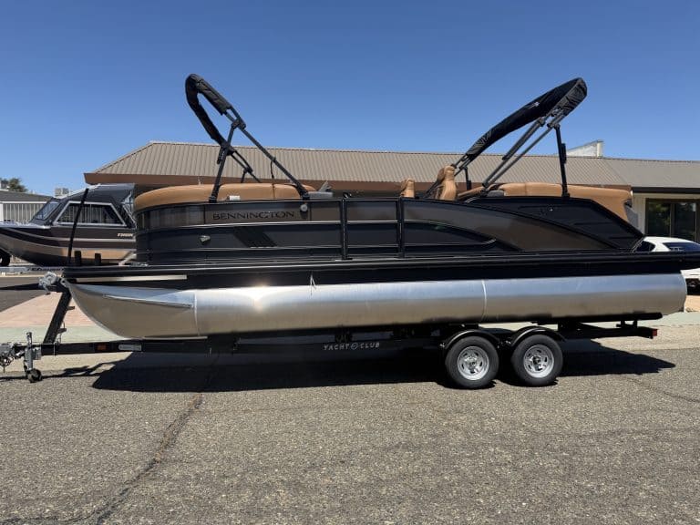 Bennington M 23 pontoon boat with 250HP outboard engine on trailer.