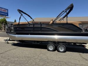 Bennington M 23 pontoon boat with 250HP outboard motor on trailer.