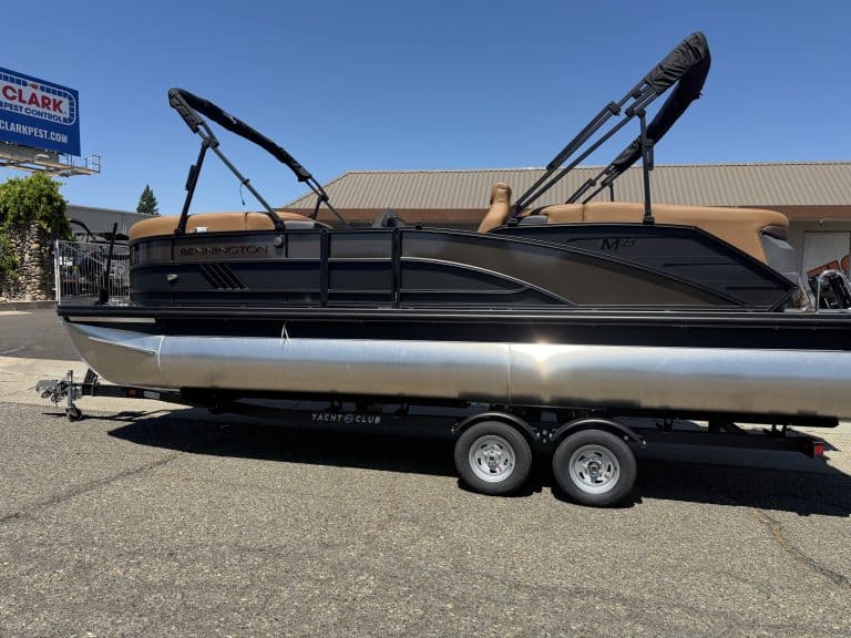 Bennington M 23 pontoon boat with 250HP outboard motor on trailer.