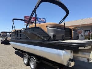 Bennington M 23 pontoon boat with 250HP outboard motor on trailer.