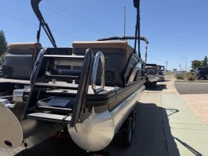 Bennington M 23 pontoon boat with 250HP outboard engine on display.
