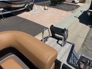 Bennington M 23 pontoon boat with seating and boarding ladder.