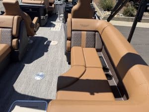 Luxury boat interior with tan seating and diamond-stitched accents.