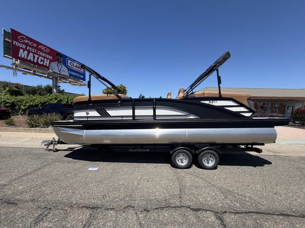 Bennington M 23 boat with 250HP outboard motor on trailer.