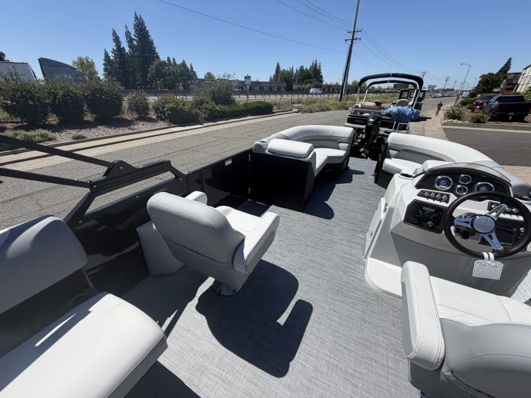 Pontoon boat interior with spacious seating and modern controls for optimal boating experience.