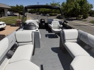Luxury pontoon boat with spacious seating and modern design for leisure and water adventures.