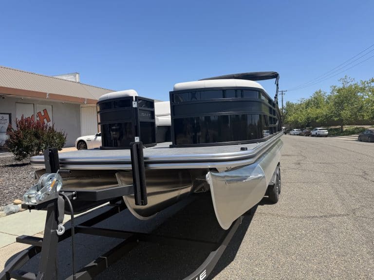 Pontoon boat with sleek black and silver design, ideal for leisure and water adventures.