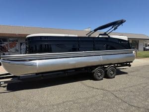 Modern pontoon boat with black and silver design, ready for water adventures.