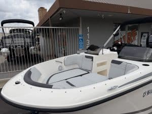 Opti boat for leisure and water sports, featuring sleek design and spacious interior.