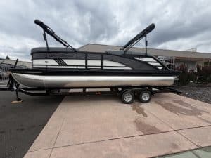 Sun Tracker pontoon boat on trailer, perfect for family boating adventures.