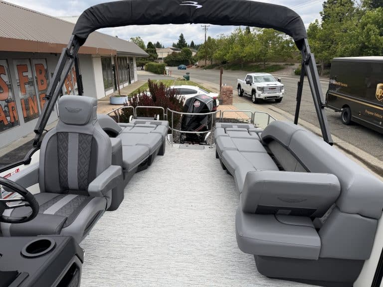 Pontoon boat with spacious seating and outboard motor, ideal for leisure cruising and fishing advent.