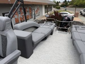 Boat seating area with outboard motor at ASFB Marine dealership.