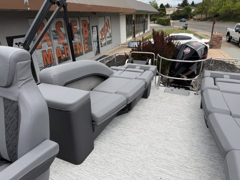 Boat seating area with outboard motor at ASFB Marine dealership.