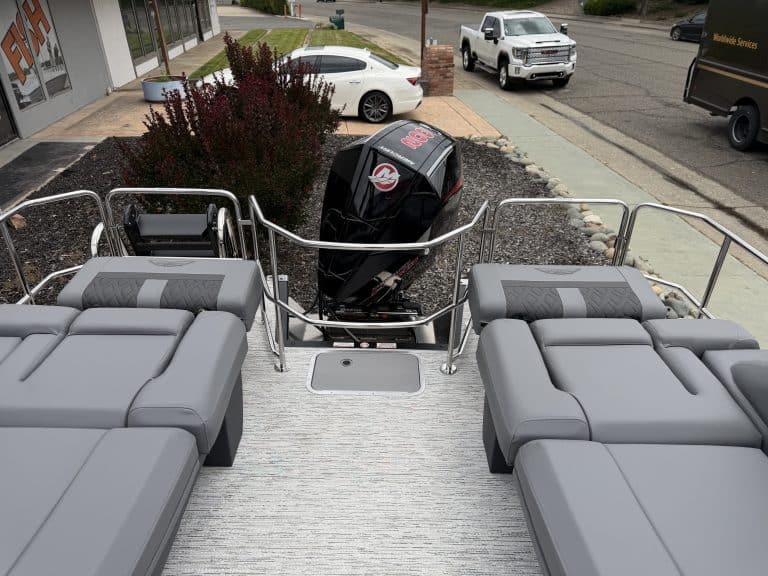 Outboard motor and comfortable boat seating on a deck, ready for marine adventures.