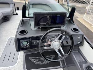 Opti boat dashboard with navigation and control systems.