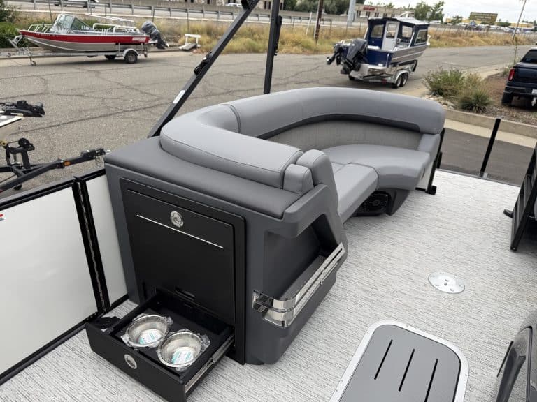 Comfortable boat lounge with built-in storage and cupholders for relaxing on the water.
