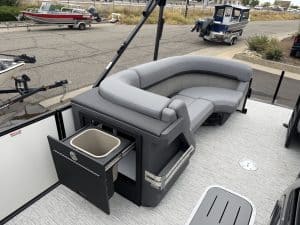Comfortable boat lounge with storage on pontoon boat for relaxing on the water.
