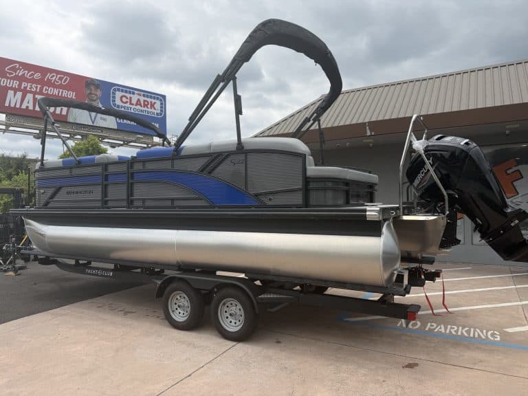 Pontoon boat with outboard motor, ideal for leisure and water activities, available for purchase at.