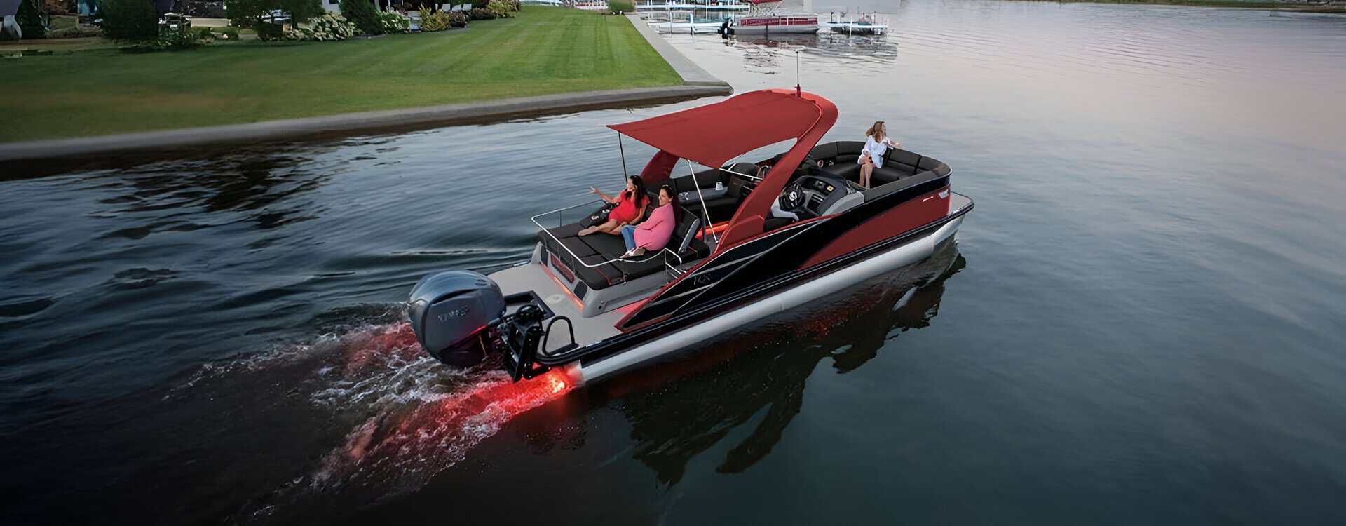 Luxury motorboat cruising on tranquil water with passengers enjoying a scenic ride.