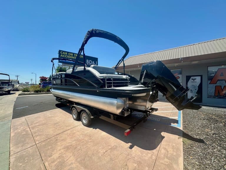 New boat on trailer outside dealership for website update.