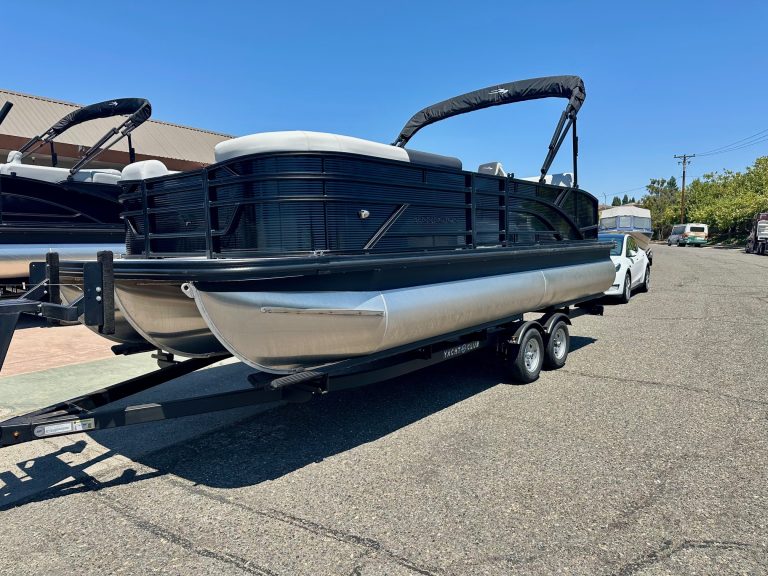 Pontoon boat on trailer ready for water adventures and leisure activities.