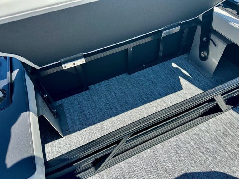 Opti boat storage compartment with secure lock for marine efficiency.