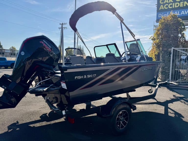 Opti-friendly fishing and ski boat with powerful outboard motor.