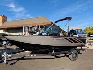 Boat trailer with boat on display at ASFB Marine, ready for transport and launch.
