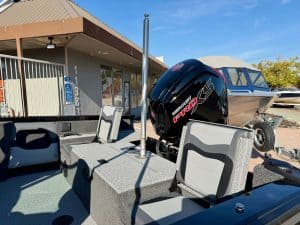 Boat with Mercury outboard motor, ready for sale at ASFB Marine, showcasing quality marine engines a.