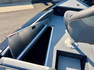 Secure storage compartment on a boat for marine equipment and gear.