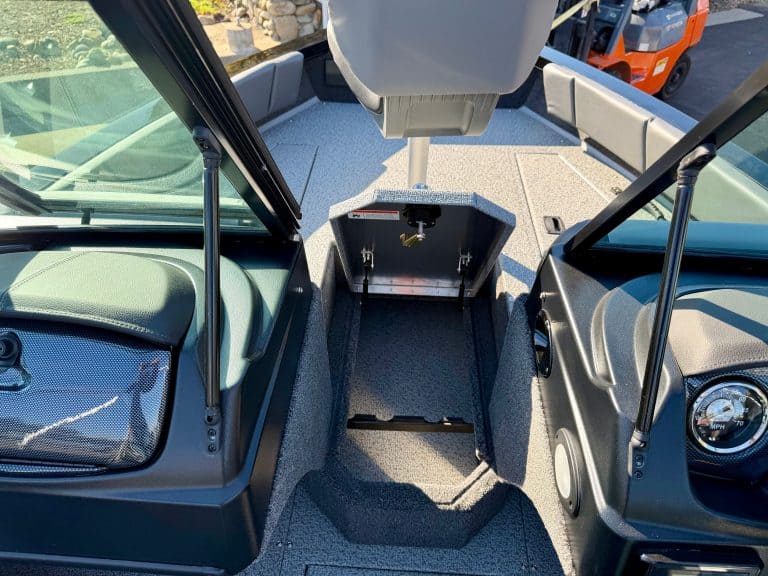 Opti boat interior with ample storage compartments for convenience.