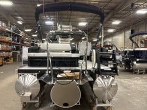 Opti pontoon boat for sale in warehouse.