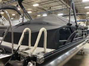 Custom marine cover for pontoon boats, providing protection and durability for all-weather condition.
