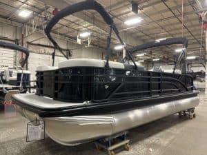 Pontoon boat with black and silver design, ready for water adventures. Perfect for leisure and famil.