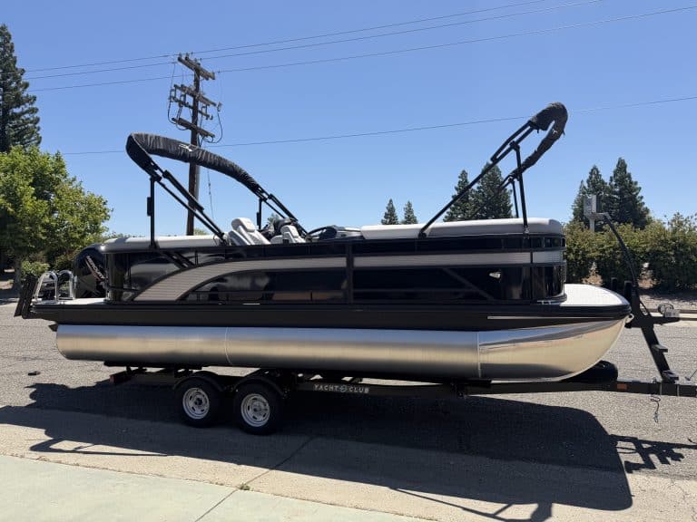 Luxury pontoon boat with T-top for water sports and leisure.