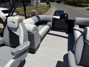 Pontoon boat interior with plush seating and modern design for leisure boating.