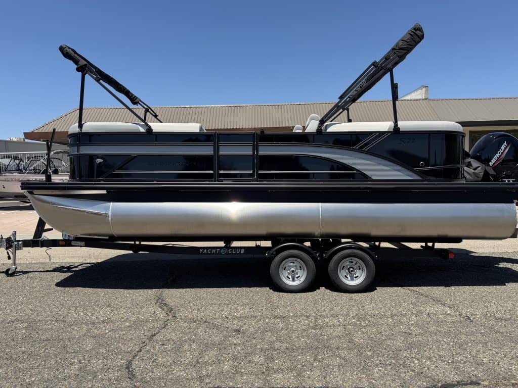 Premium pontoon boat with sleek black and white design, ideal for water sports and leisure activitie.