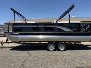 Premium pontoon boat with sleek black and white design, ideal for water sports and leisure activitie.