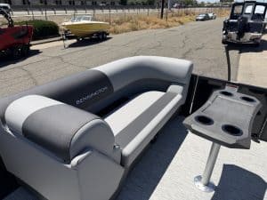 Bennington pontoon boat seating with built-in table for comfort and socializing.