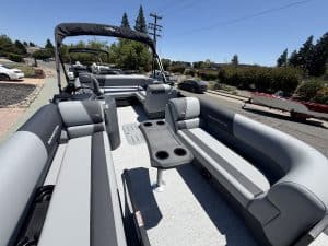 Recreational boat interior featuring comfortable seating and steering console, ideal for water adven.