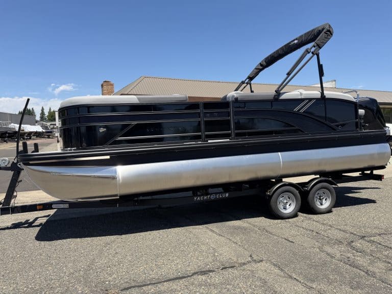 Pontoon boat on trailer, ideal for recreational boating and water fun. Perfect for family outings an.